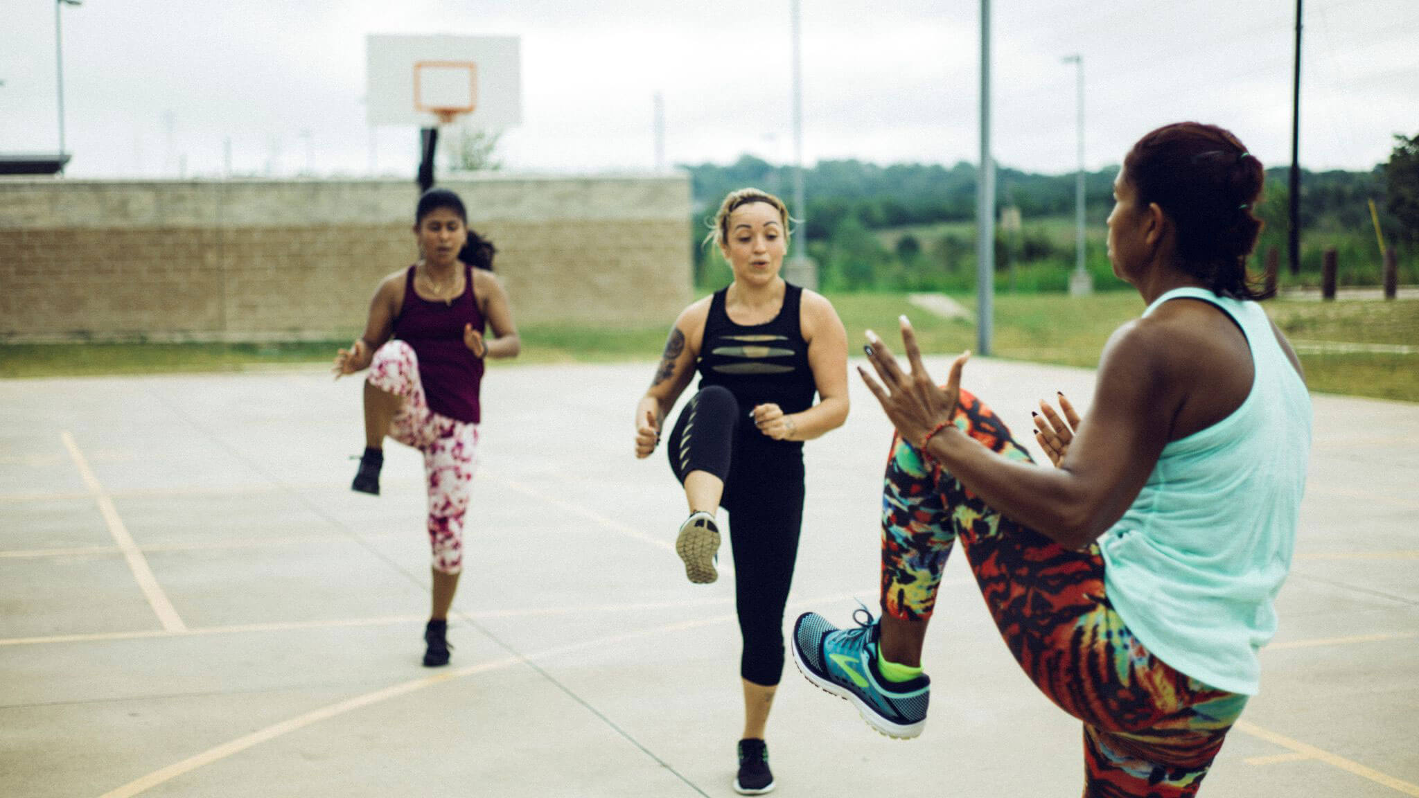 A group of women participating in a kickboxing workout